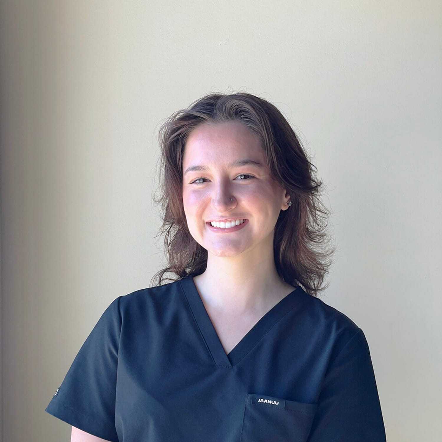 Portrait of Angela, a professional stylist at Masque by Mask Balanced Skincare, showcasing their expertise and style.