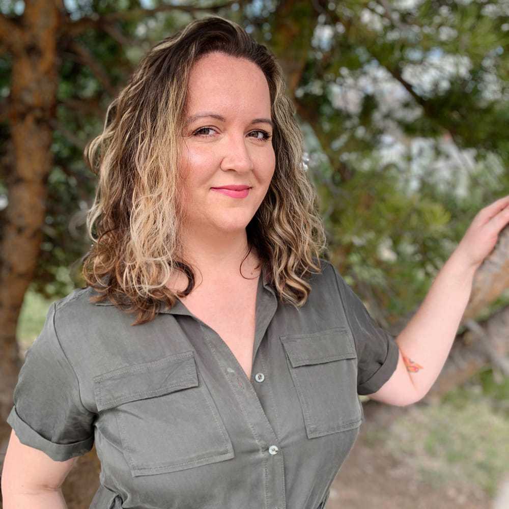 Portrait of Sarah, a professional stylist at Masque by Mask Balanced Skincare, showcasing their expertise and style.
