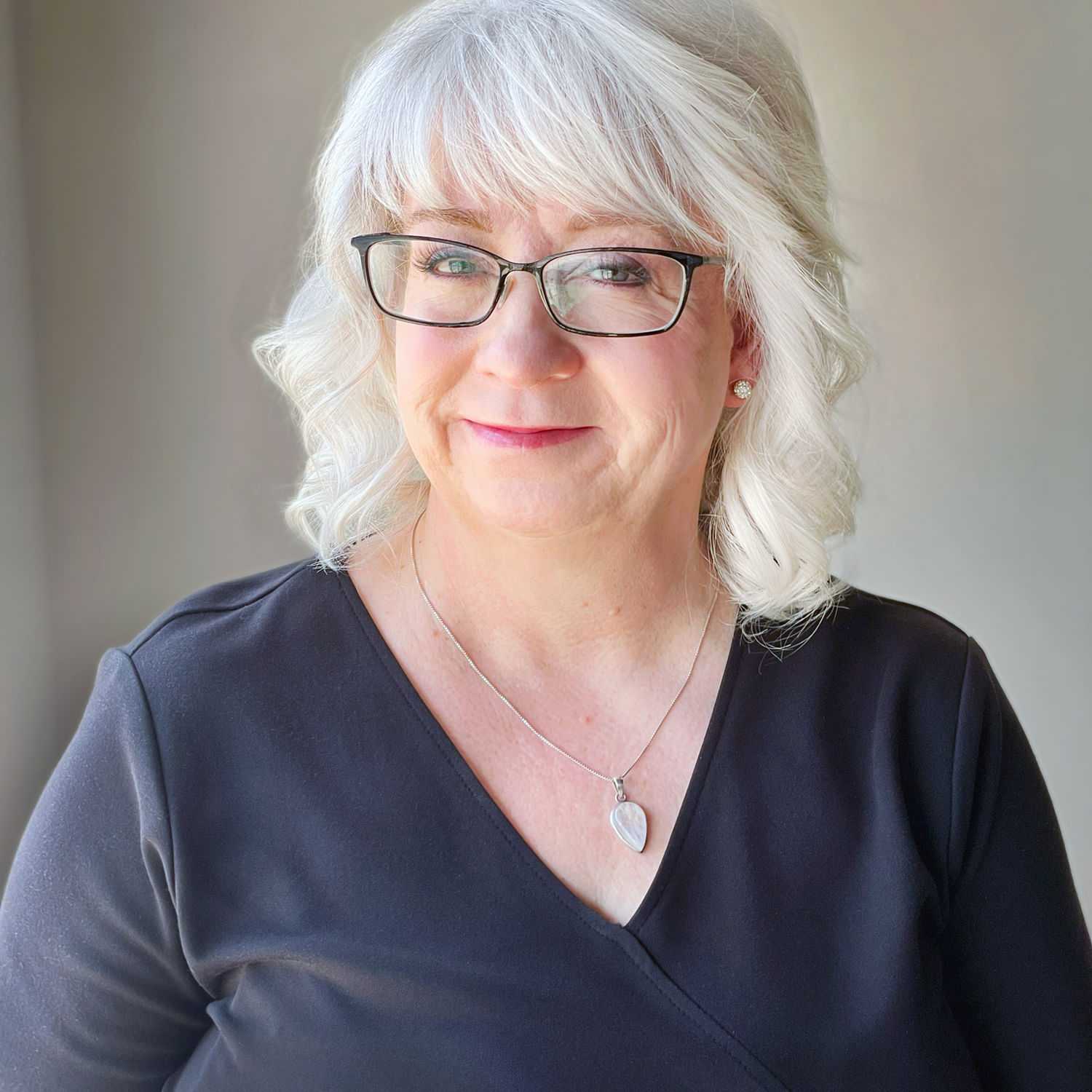 Portrait of Amy, a professional stylist at Masque by Mask Balanced Skincare, showcasing their expertise and style.