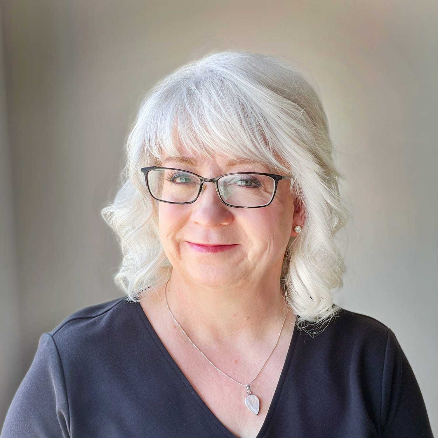 Portrait of Amy, a professional stylist at Masque by Mask Balanced Skincare, showcasing their expertise and style.