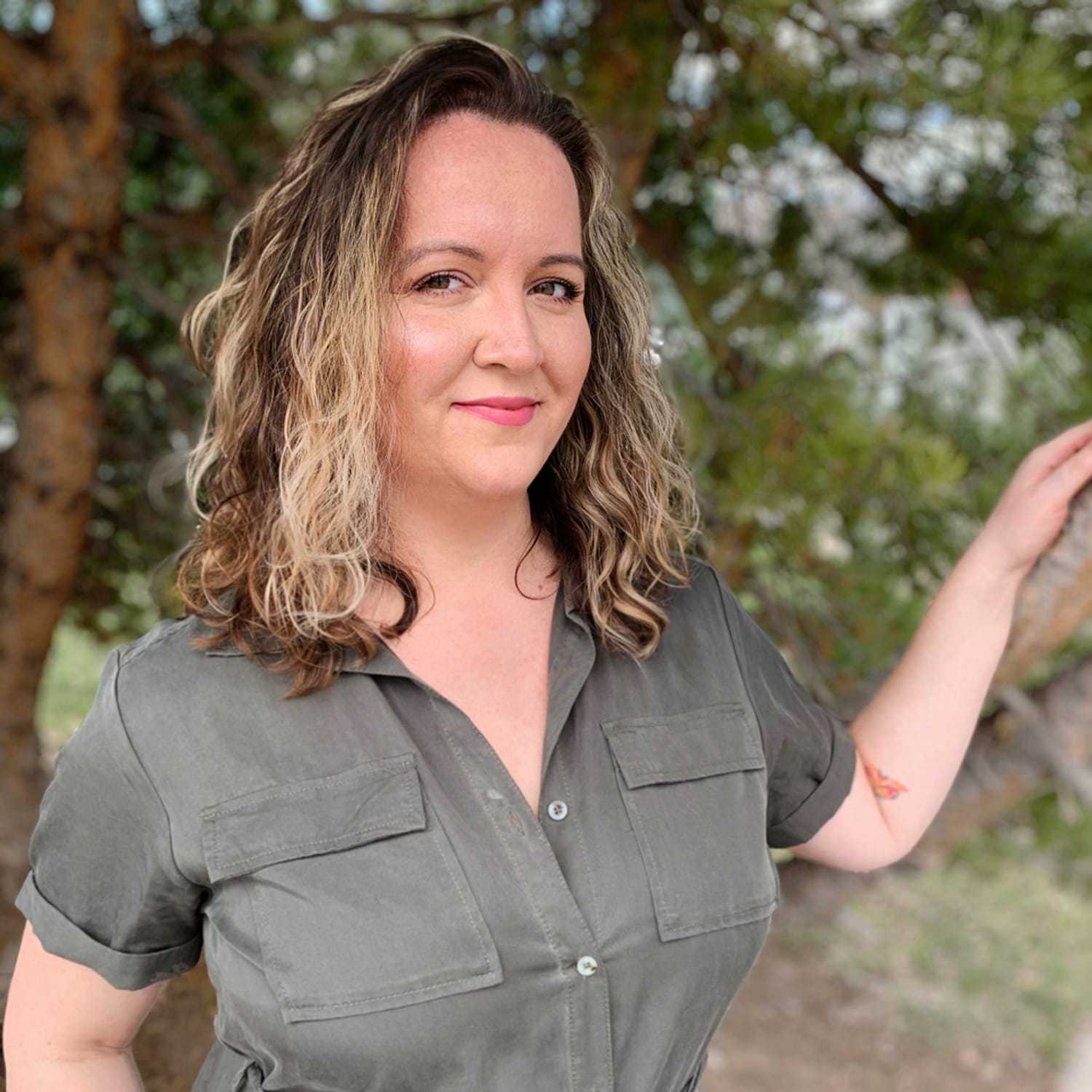 Portrait of Sarah, a professional stylist at Masque by Mask Balanced Skincare, showcasing their expertise and style.